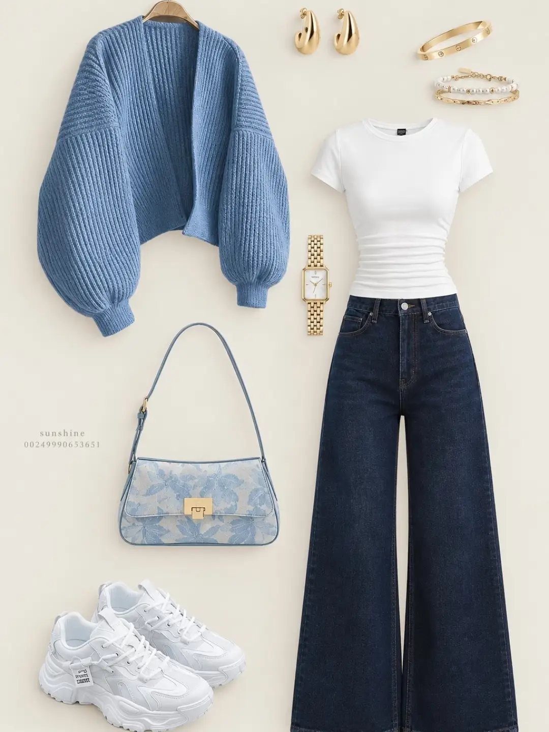 Flat lay of a blue cardigan, white t-shirt, dark jeans, white sneakers, and gold accessories.