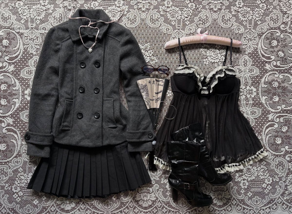Dark coquette clothing items including a grey jacket, black pleated skirt, lace top, and boots.