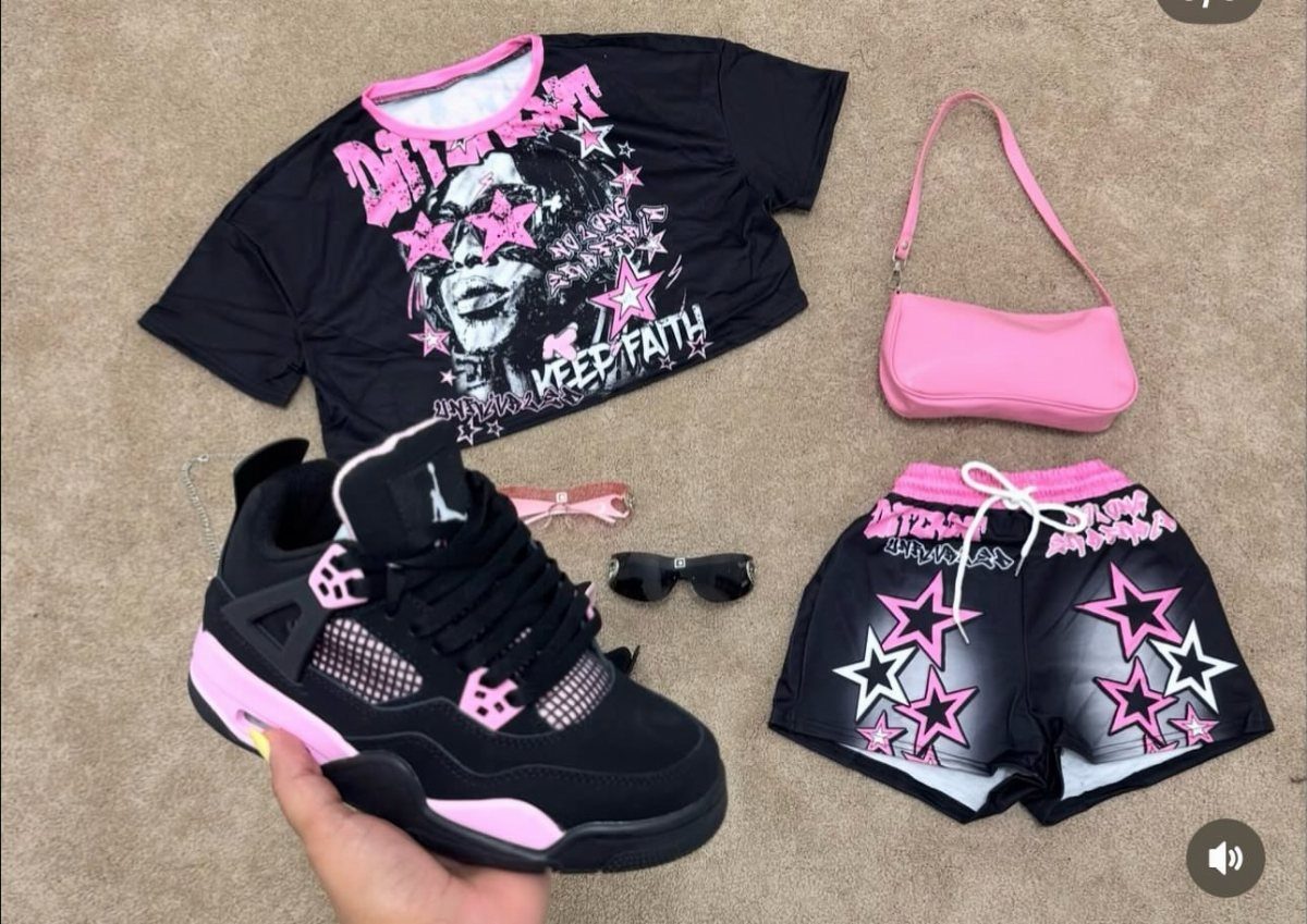 Black and pink graphic t-shirt and shorts set with matching accessories and sneakers.
